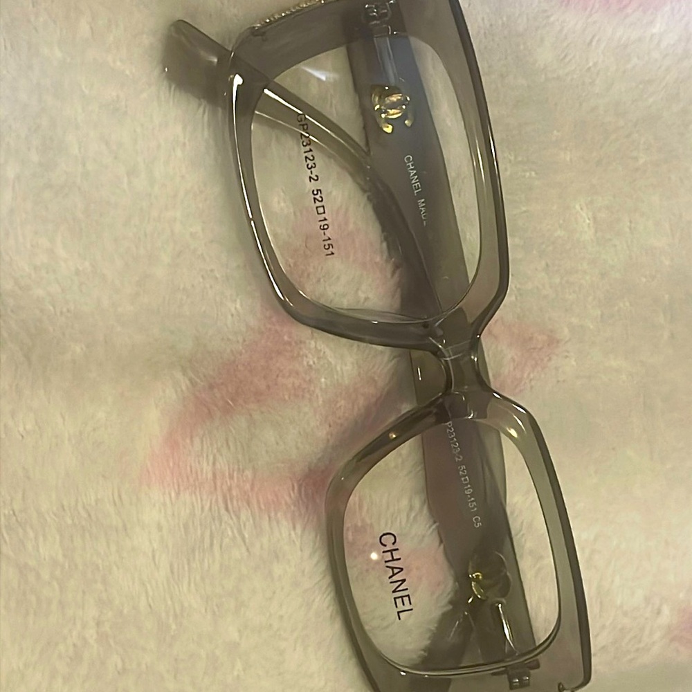 Chanel clear frames with a light smoke gray outer frame color.